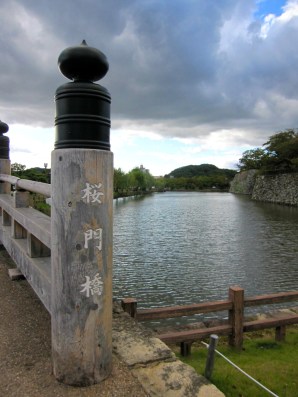 sakuramon bridge at the entrance and the moat surrounding the whole himeji castle complex